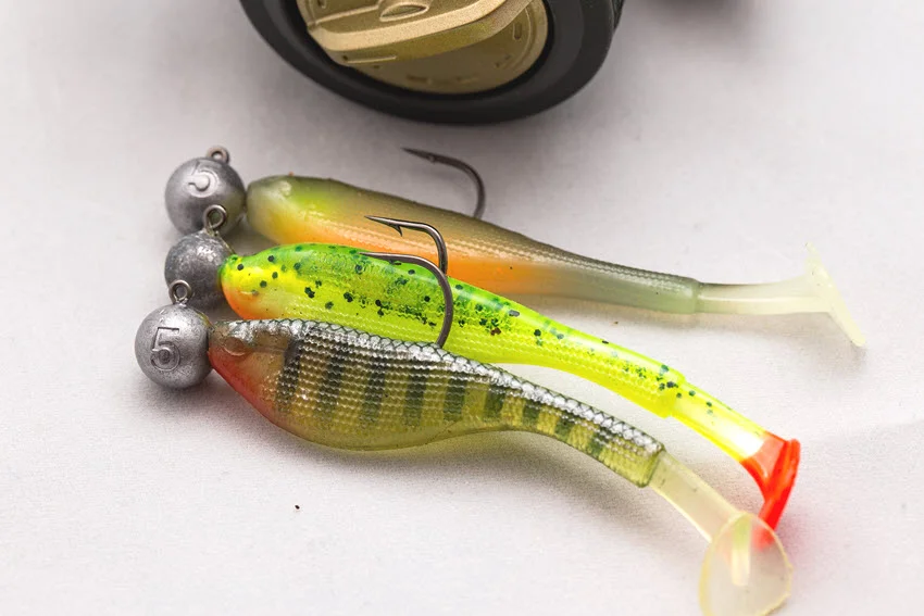 Soft plastic paddle tail lures rigged with jig head hooks, showing a simple freshwater lure setup for covering structure, banks, and deeper edges.