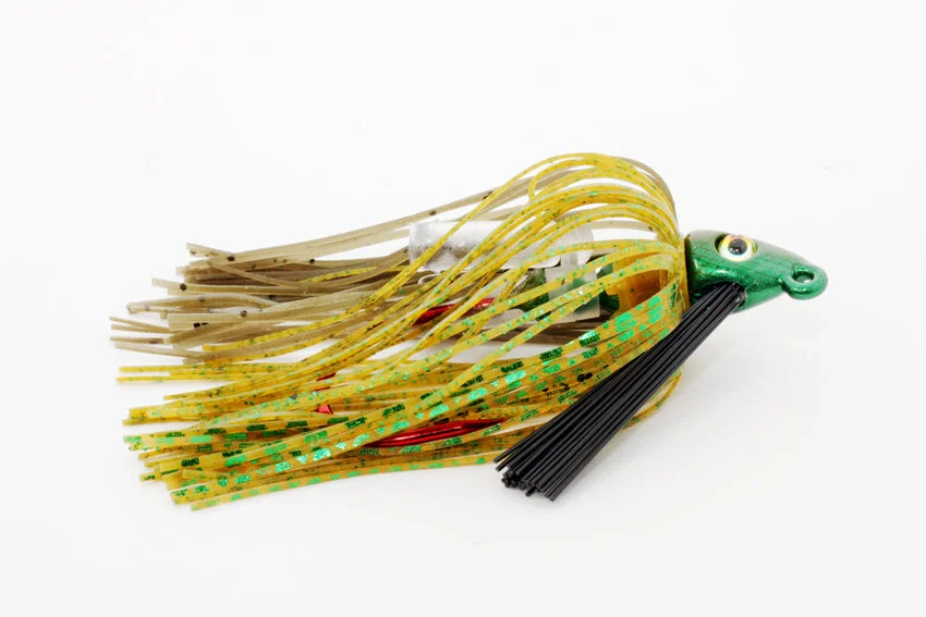 Close-up of a jig lure for fishing, featuring a colorful design and sharp hooks, ready to attract various fish species.