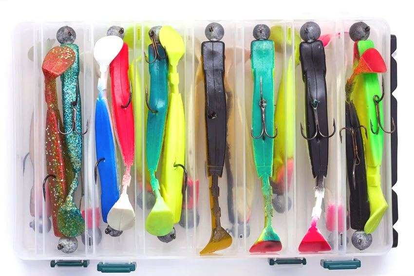 Various soft plastic fishing lures with attached hooks, designed for freshwater and saltwater fishing.