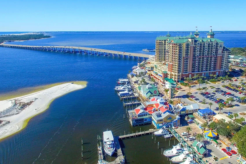 Aerial view of Destin Harbor, marina, and bridge on a clear day in Florida, one of the top Gulf Coast areas for Cobia fishing trips.