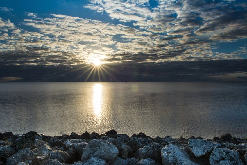 Okeechobee Lake and its rocky coast are bathing in the evening sun.