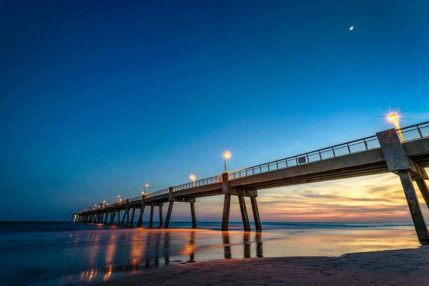 A fishing pier at night. This pier is located in Florida on Okaloosa Island.