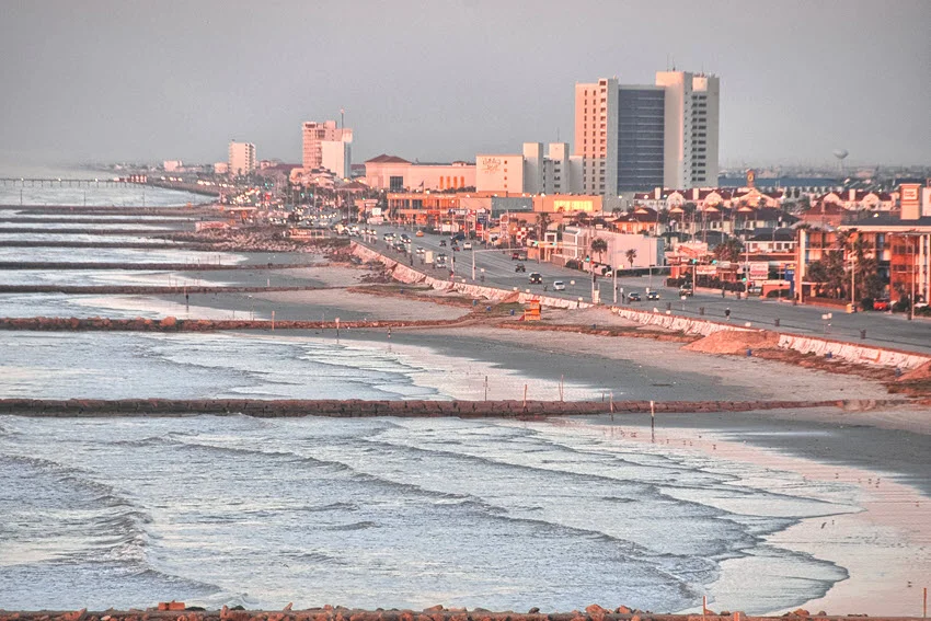 Galveston, Texas cityscape in the vibrant colors of the spring season. The coastal town comes to life with blooming flowers, lush greenery, and scenic views of historic architecture and the Gulf of Mexico.