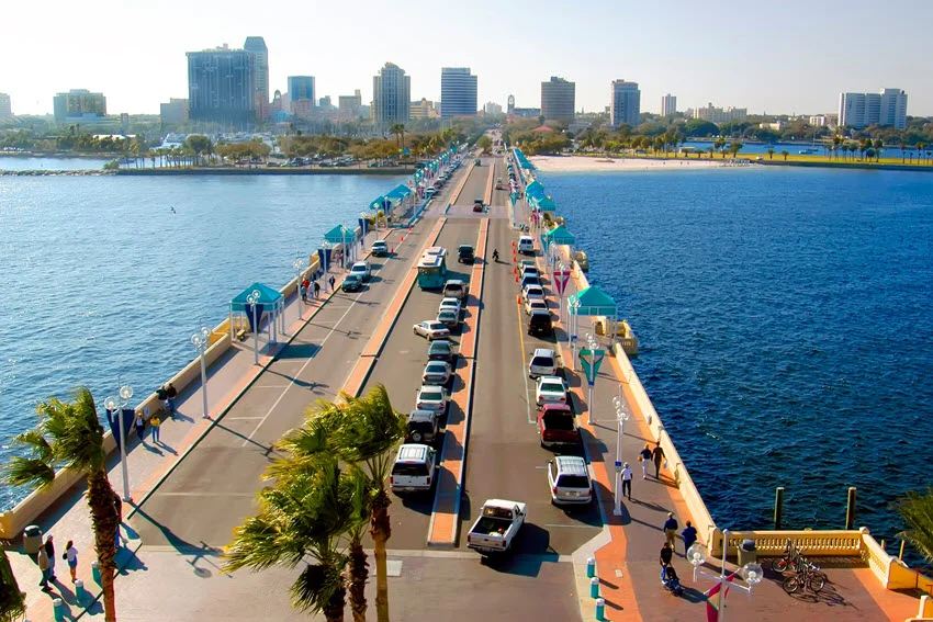 View of the St. Pete Pier extending into Tampa Bay from downtown St. Petersburg, Florida, showcasing its modern design, vibrant surroundings, and scenic coastal views.