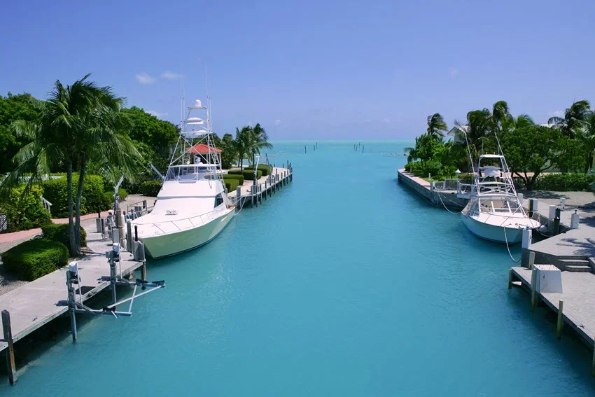 Aerial view of Florida Keys fishing boats in the turquoise, tropical waterway on a sunny day.