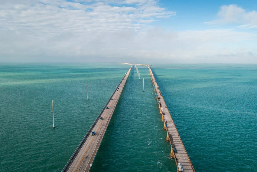 Aerial view of the Seven Mile Bridge extending out over the ocean to the lower Florida Keys.