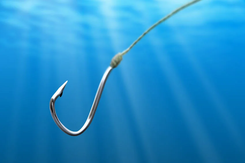 A fishing hook in the sea is used for light tackle fishing.