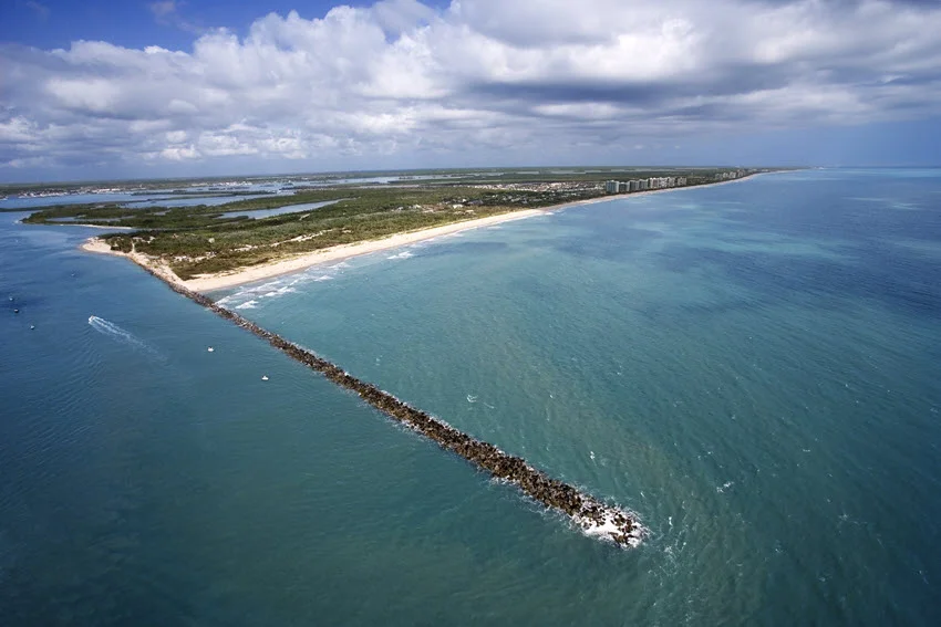 Aerial drone view of the jetties and beach at Fort Pierce, Florida.