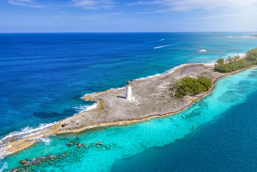 Aerial view of Nassau Harbour Lighthouse located on Paradise Island, New Providence, Bahamas, surrounded by the turquoise waters of the Caribbean Sea.