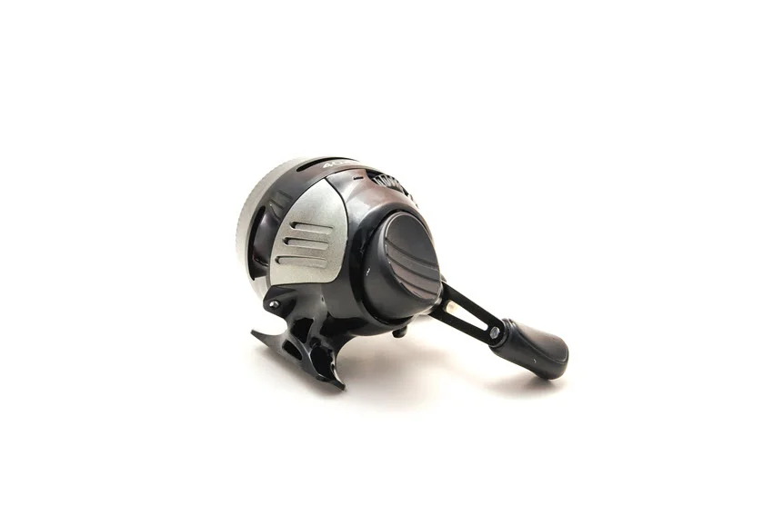 Spincast reel on white background.