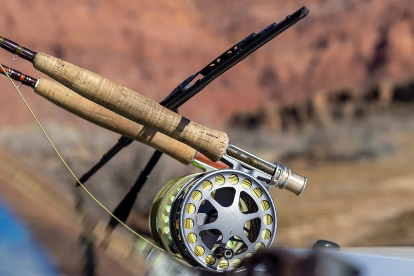 An image of two fly rods with fly reels.