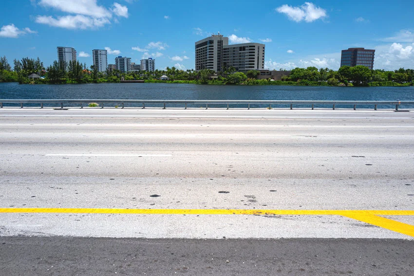 View across Miami's Blue Lagoon from Dolphin Expressway, showing an urban waterway within South Florida's wider Peacock Bass fishing region.