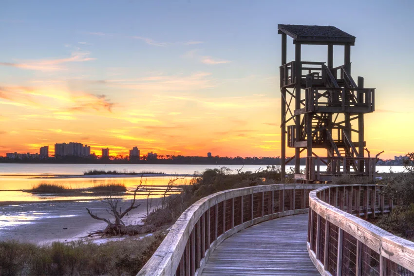 Observation tower silhouetted against a Perdido Key State Park sunset.