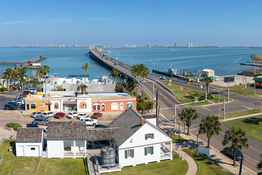 Coastal view of Port Isabel, Texas with the bridge, waterfront, and marina access, showing the warm inshore water and structure lines where anglers often look for Snook on moving tides.