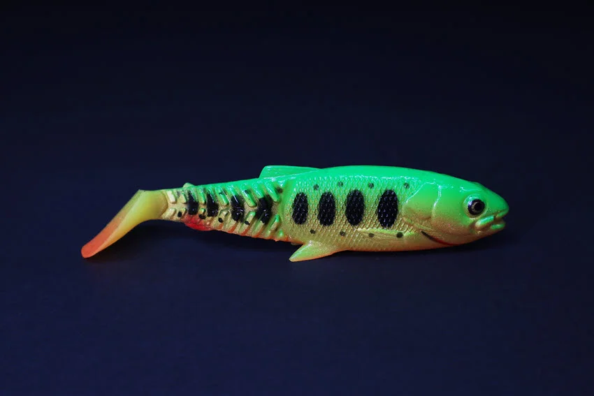 Colorful soft plastic fishing lure designed to mimic baitfish, ideal for attracting predatory fish in freshwater and saltwater.