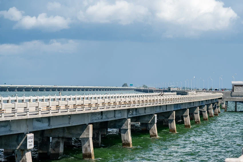 A panoramic, right side view of The Skyway Fishing Pier, on cloudy day.