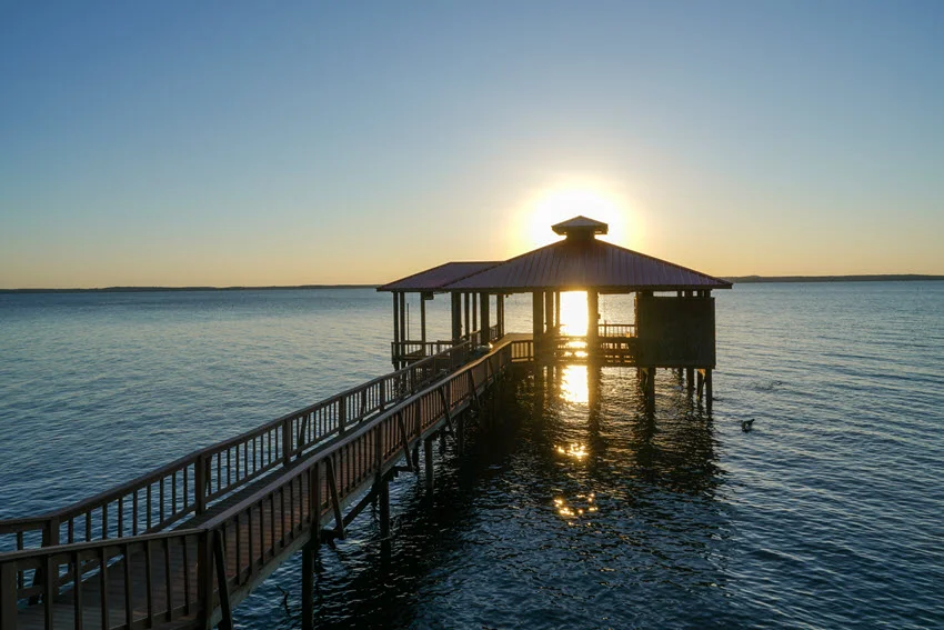 Fishing and boat pier, during sunset on Toledo Bend water.