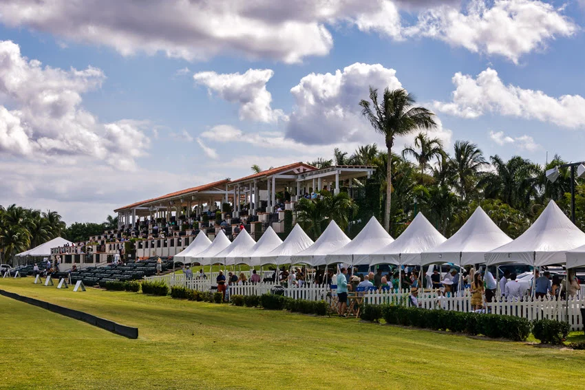A tournament field with audience stalls and gazebos ready for one of the competitions in West Palm Beach